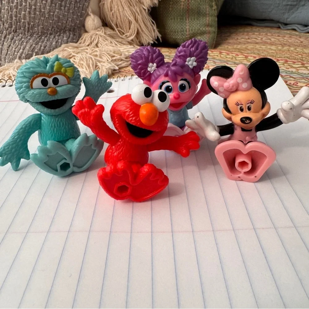 Colorful Sesame Street Neighborhood Friends and Minnie Mouse figurines